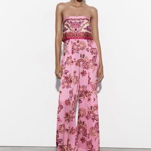 Gorgeous pink jumpsuit. Never worn!!